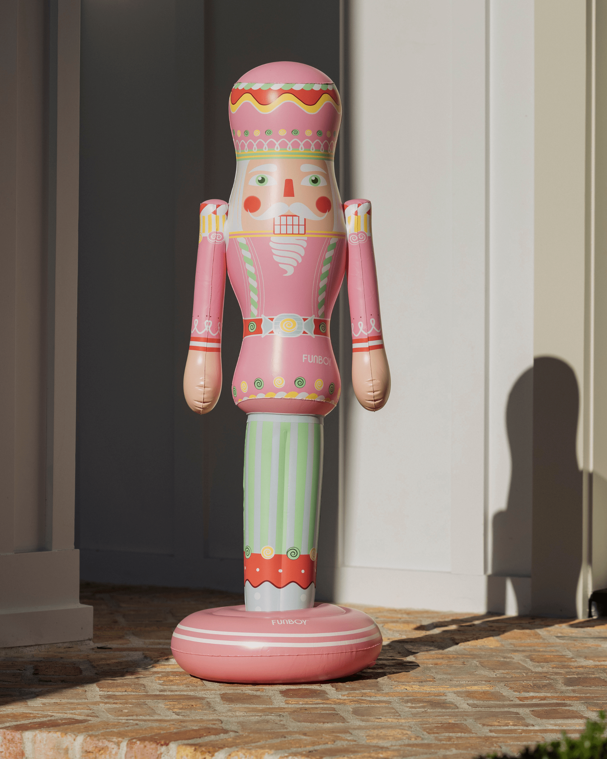 Decorative inflatable nutcracker figure on a patio
