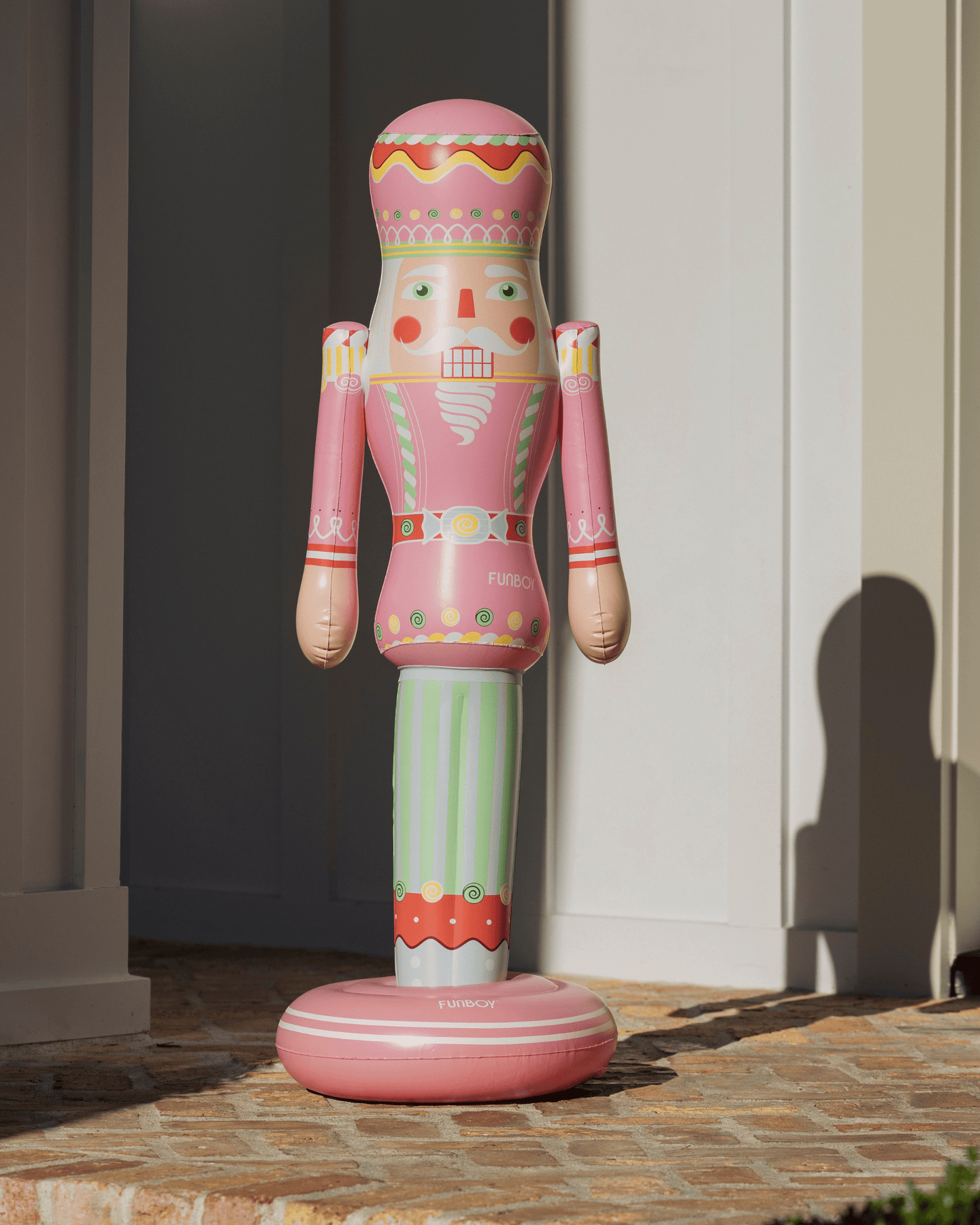 Decorative inflatable nutcracker figure on a patio
