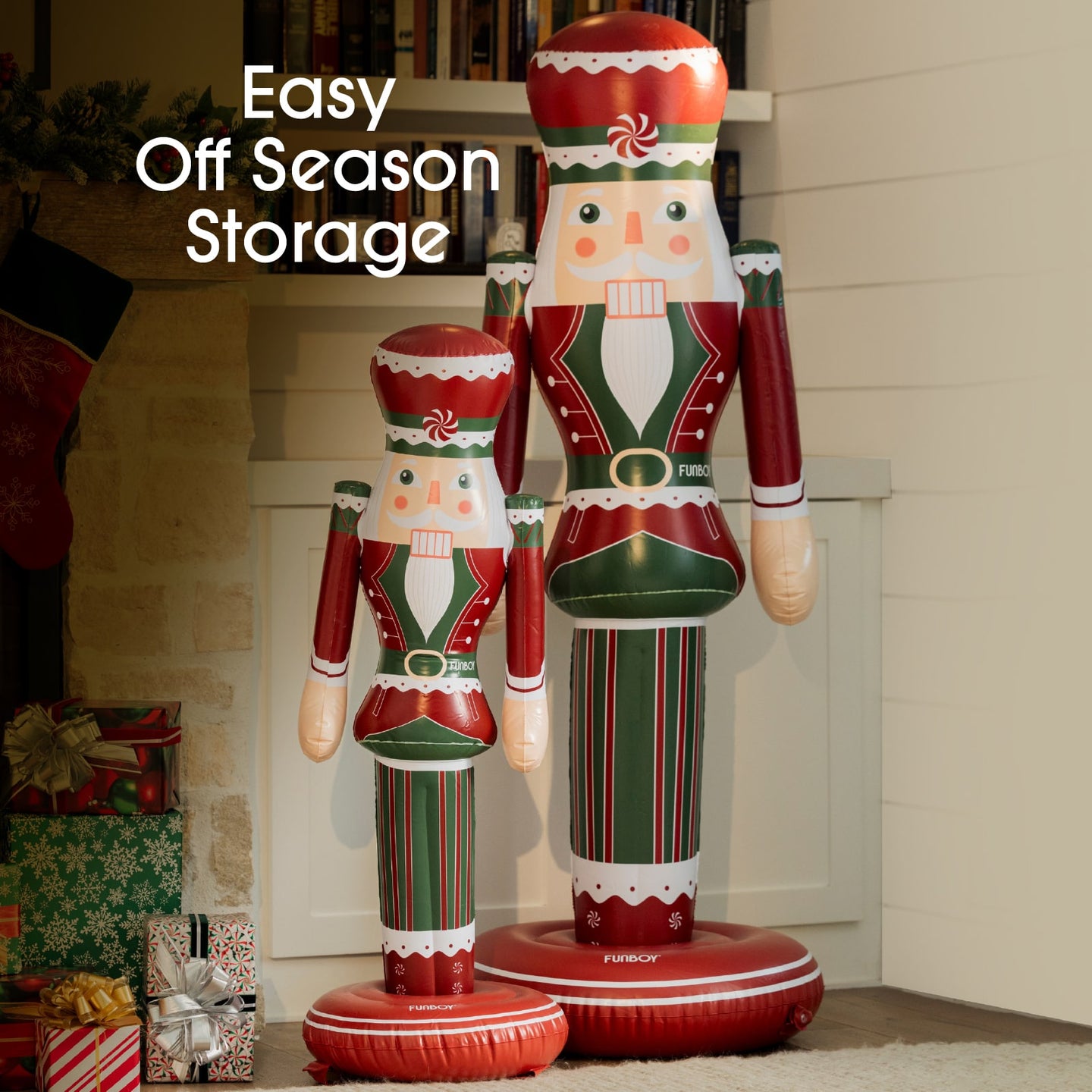 Two inflatable nutcrackers in red, green, and white standing in front of a fireplace with Christmas decorations.