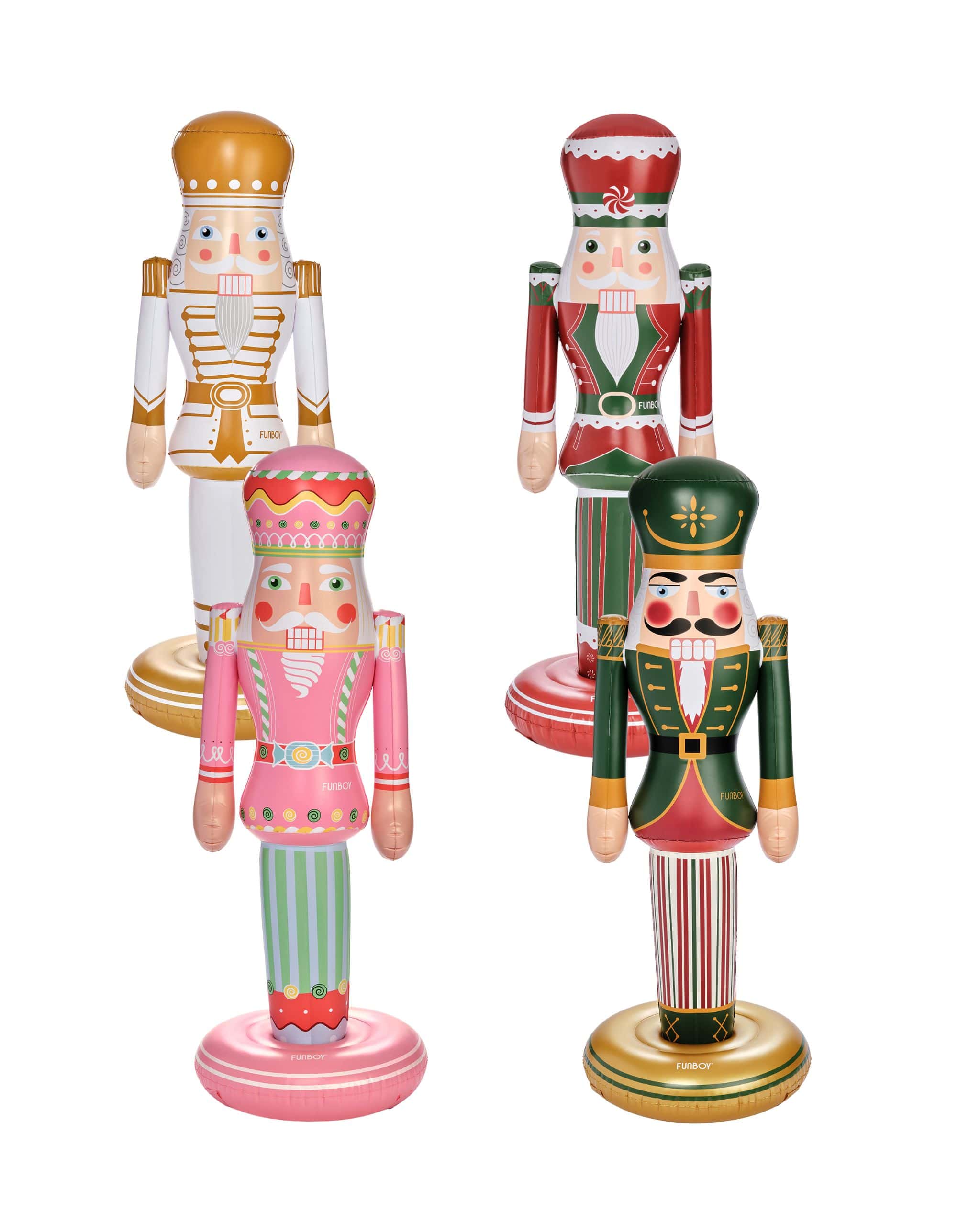 Four colorful nutcracker figurines on a white background