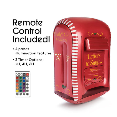 Red mailbox with Santa Claus design and remote control on a white background