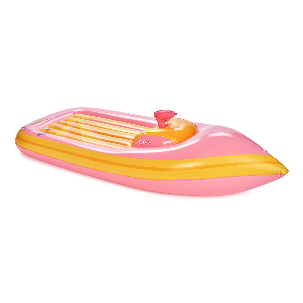 Inflatable pink and yellow boat yacht pool float on a white background