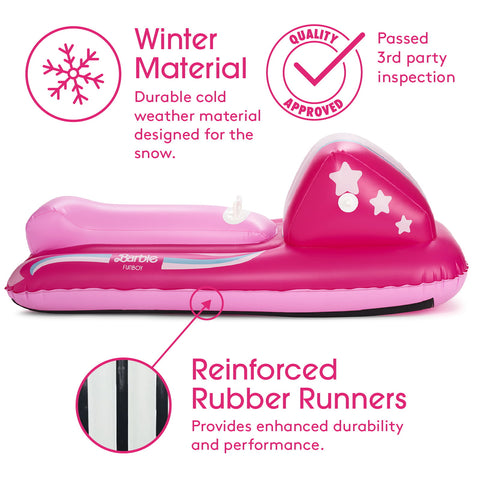 Pink inflatable snowmobile float on a white background with promotional text and callout graphics highlighting winter material, quality approval, and reinforced rubber runners.