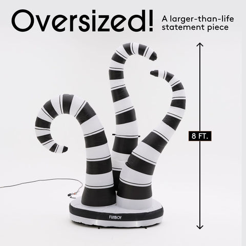An oversized black and white striped self-inflating halloween decorations statement piece on a white background, with text reading 'Oversized! A larger-than-life statement piece' and a height marker of 8 FT.-