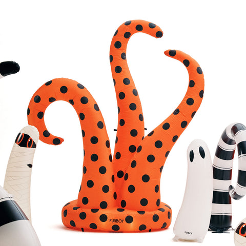 An orange inflatable octopus decoration with black polka dots, shown on a clean white background with other Halloween-themed inflatable decorations partially visible around it.