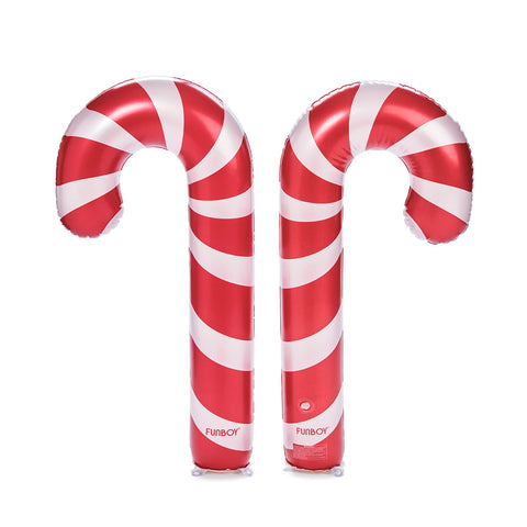 Two inflatable candy cane pool floats with red and white stripes, standing upright on a white background.