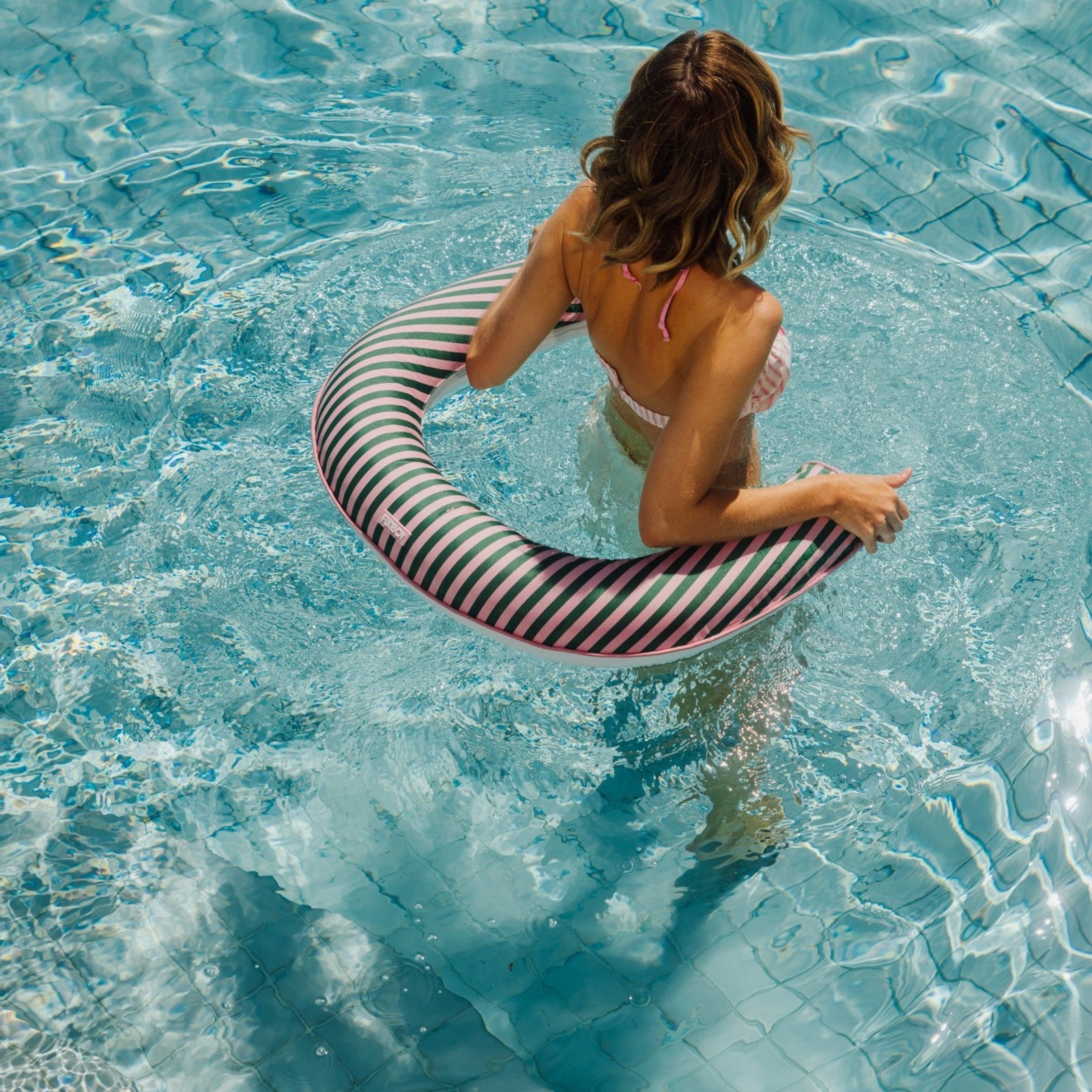 Striped  pink and green stripes on a fabric noodle float