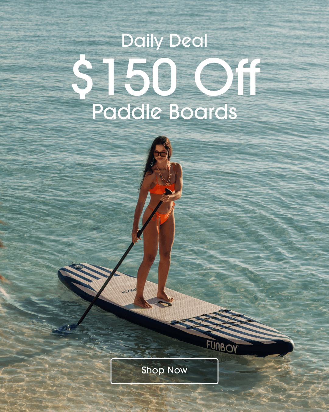 Woman on a paddle board with promotional text overlay saying $150 Off Paddle Boards