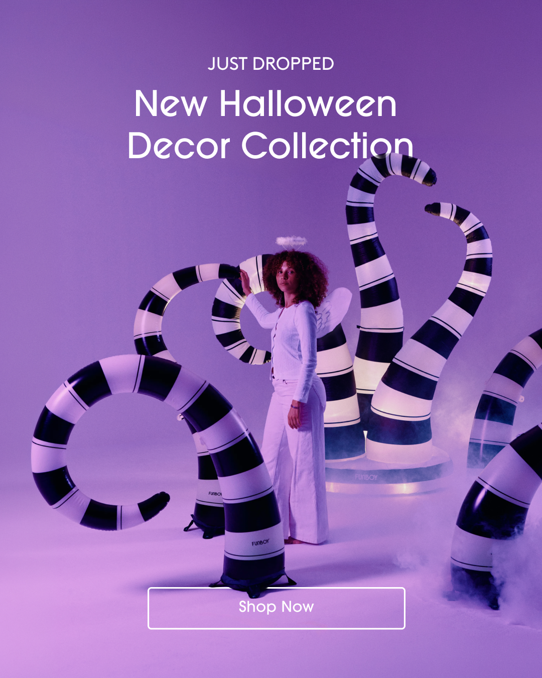 A promotional graphic for the 'New Halloween Decor Collection' featuring a model in a white outfit standing among large, black and white striped inflatable tent-like decorations against a purple-lit studio background.
