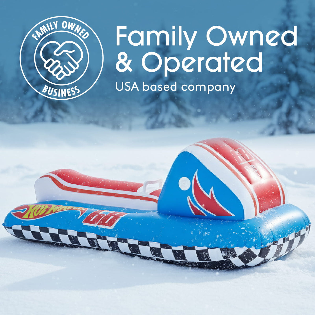 An inflatable water slide slide in a snowy outdoor setting, featuring a blue base with a black-and-white checkered border, a red and white striped slide track, and a blue headrest with red and white graphics. Prominent text in the upper right reads 'Family Owned & Operated' and 'USA based company,' with a circular family-owned business emblem in the upper left.