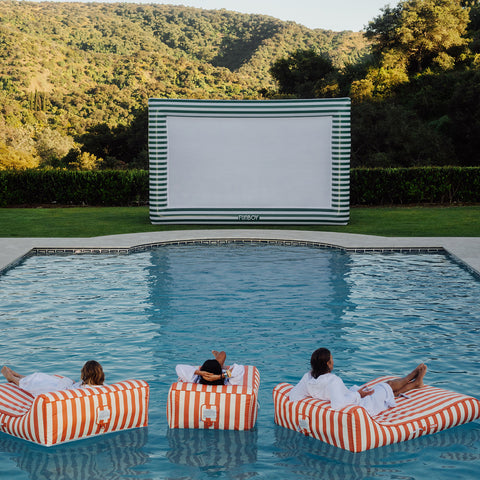 green and white movie screen with people watching a movie