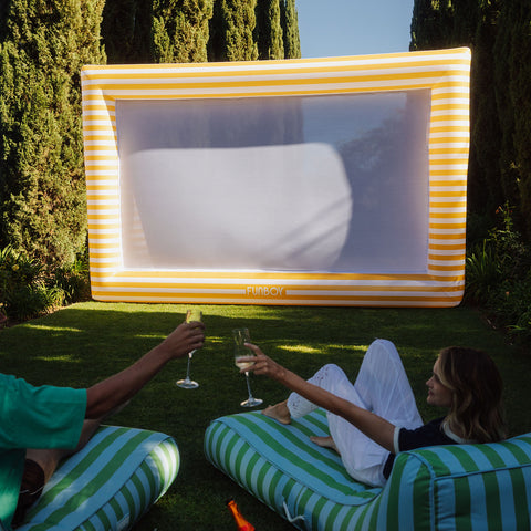 inflatable outdoor movie screen with people watching