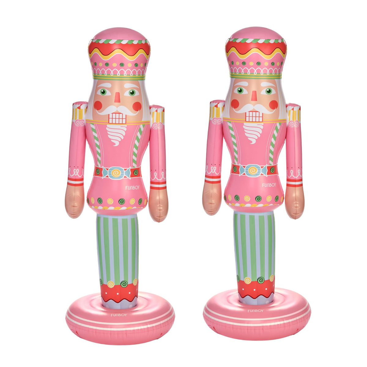 Two pink nutcracker-shaped inflatables on a white background, each with green striped legs and colorful decorative details.