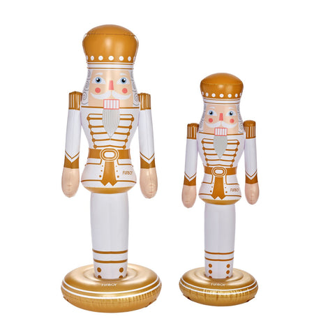 Two decorative nutcracker figurines on a plain white background, one large and one small.