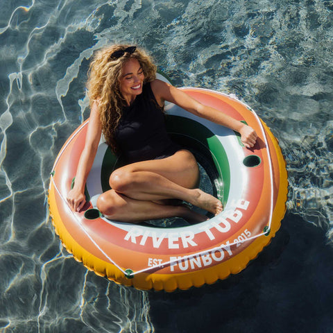 Woman on a 'River Tube' float in clear water