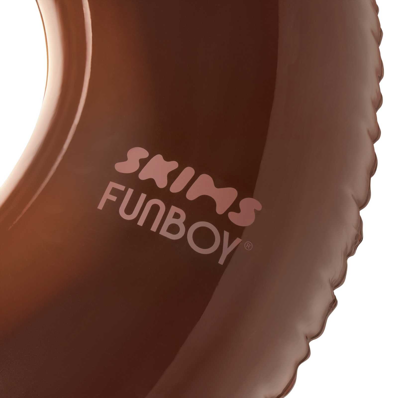 Close-up of a brown product with 'SKIMS FUNBOY' branding