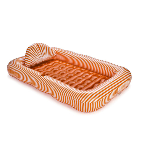 Inflatable orange and white tanning lounger float with striped design on a white background