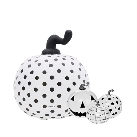 Three inflatable Halloween pumpkins in white with black polka dots and jack-o'-lantern faces, shown on a plain white background. The largest pumpkin has a curved black stem, and the smaller pumpkins have black web-like line patterns.