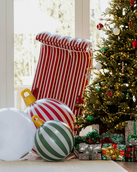 Decorative Christmas scene with striped ornaments and a tree in a room