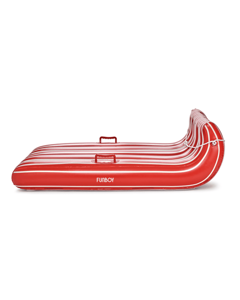Red inflatable snow sled with white stripes on a white background