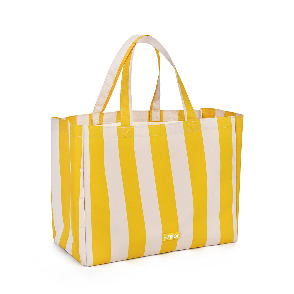 Yellow and white striped tote bag on a white background