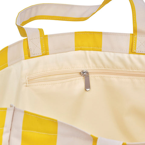 Yellow and beige striped tote bag with a zipper detail on a white background